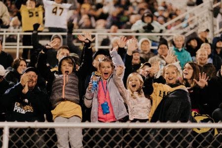 kids cheering in a sport event